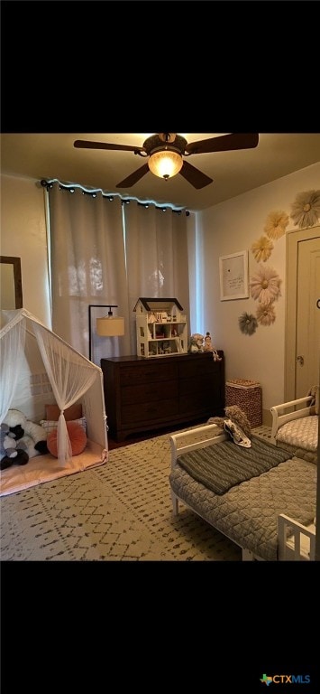 bedroom featuring hardwood / wood-style flooring and ceiling fan