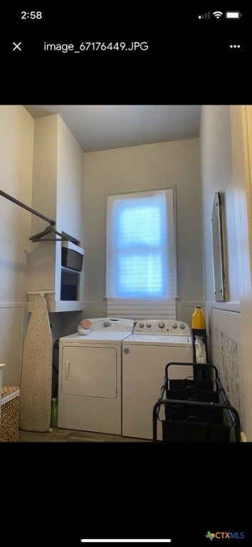 clothes washing area featuring washer and dryer