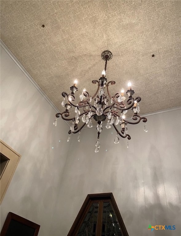 room details featuring a chandelier and ornamental molding