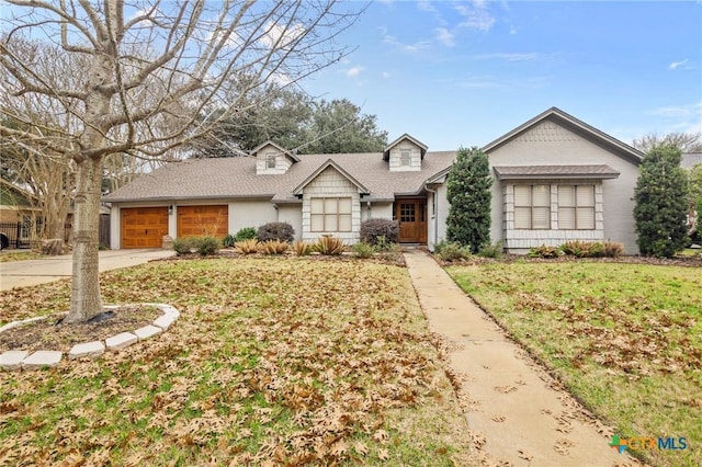 ranch-style home with a garage and a front lawn