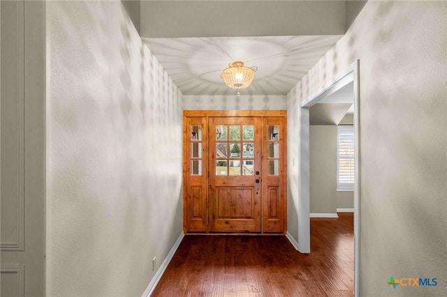 foyer entrance featuring dark hardwood / wood-style floors