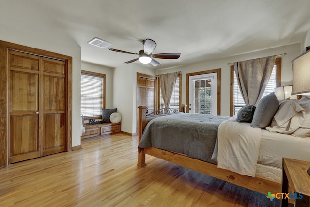 bedroom featuring light wood-type flooring, ceiling fan, and access to exterior