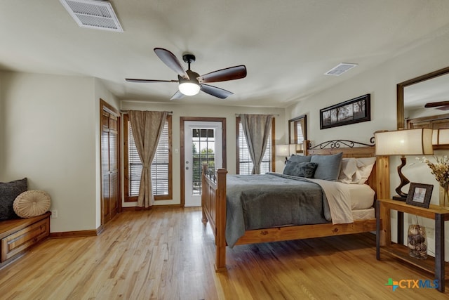 bedroom with light hardwood / wood-style floors, ceiling fan, and access to exterior