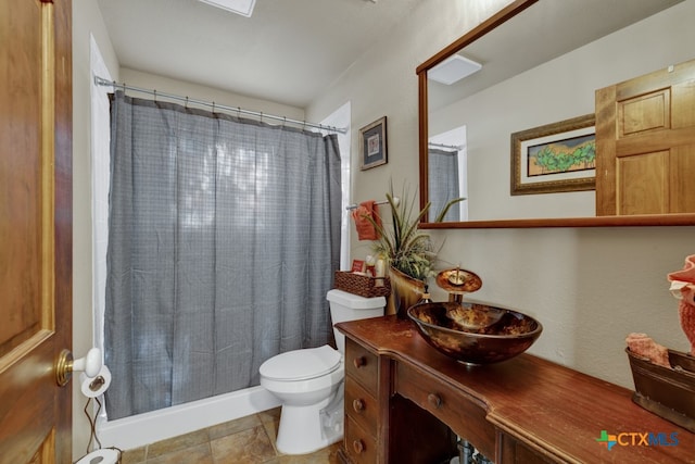 bathroom with toilet, vanity, tile patterned floors, and walk in shower