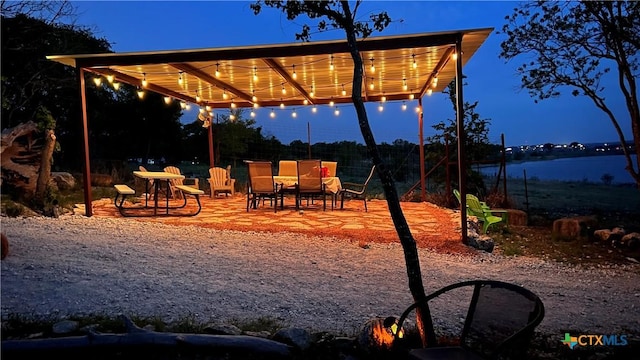 view of patio / terrace with a water view