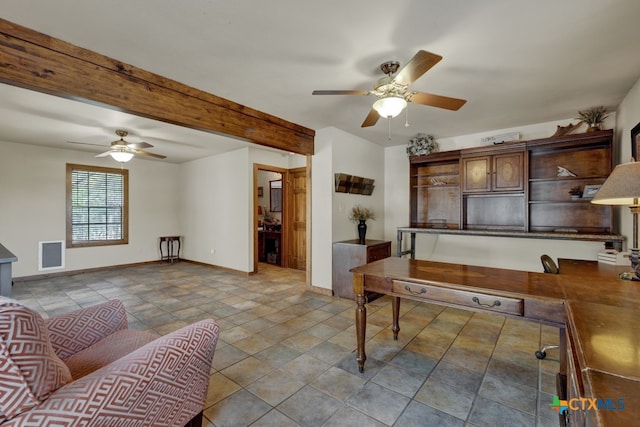 home office featuring beamed ceiling and ceiling fan