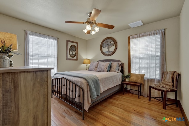 bedroom featuring ceiling fan and light wood-type flooring