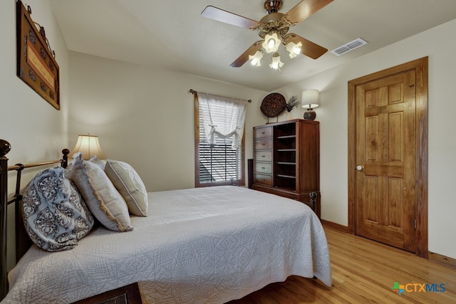 bedroom with ceiling fan and light hardwood / wood-style flooring