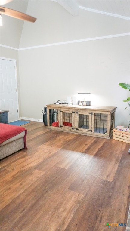 living room with hardwood / wood-style flooring, ceiling fan, and high vaulted ceiling