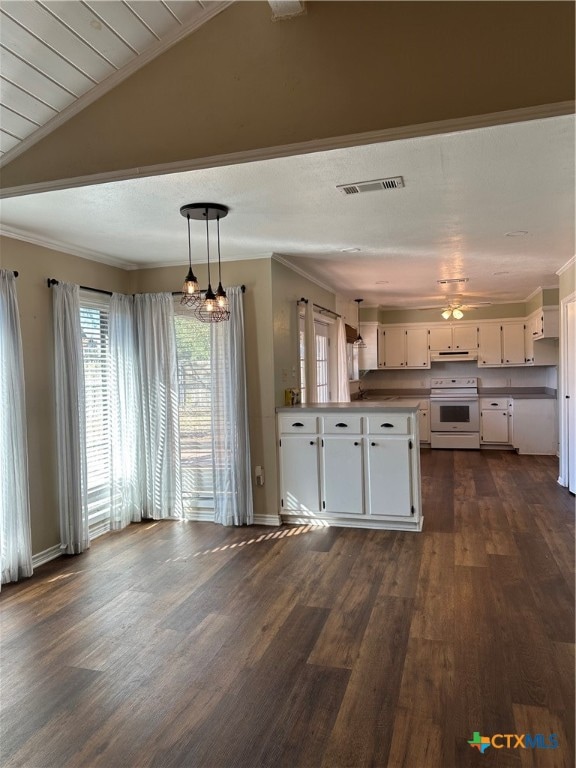 kitchen featuring pendant lighting, white cabinetry, dark wood-type flooring, and electric stove