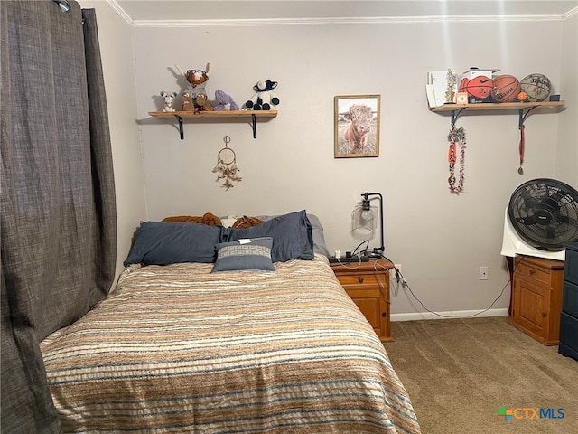 bedroom with crown molding and carpet floors