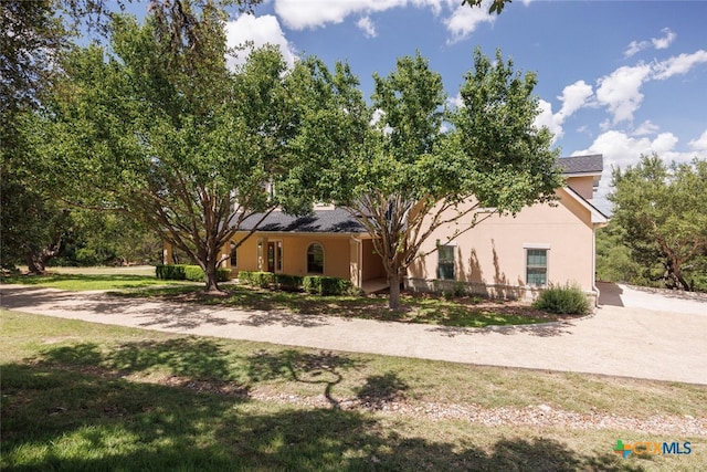 2291 Frontier, Spring Branch, TX 78070 - view of front of home featuring stucco siding and a front lawn