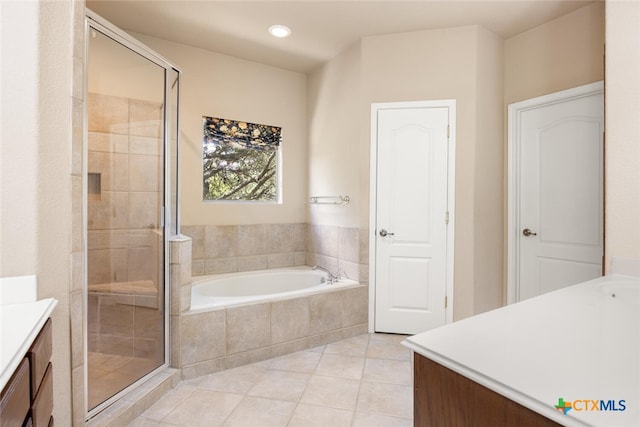 2291 Frontier, Spring Branch, TX 78070 - full bathroom featuring vanity, a bath, tile patterned flooring, a shower stall, and recessed lighting