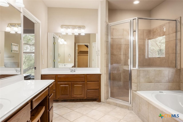 2291 Frontier, Spring Branch, TX 78070 - bathroom featuring a stall shower, two vanities, tile patterned floors, a garden tub, and recessed lighting
