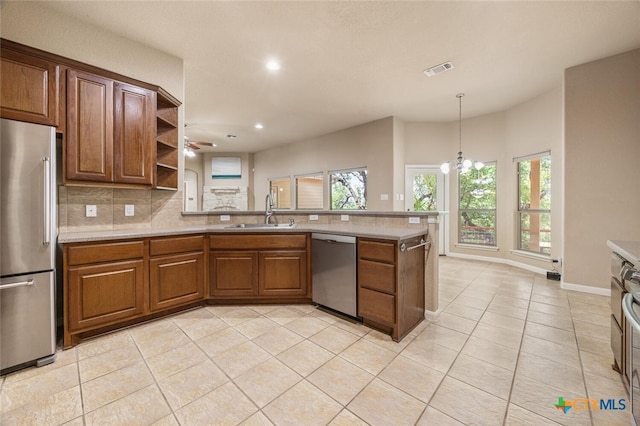 2291 Frontier, Spring Branch, TX 78070 - kitchen with appliances with stainless steel finishes, a peninsula, light tile patterned floors, open shelves, and light countertops