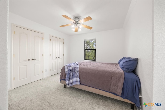 2291 Frontier, Spring Branch, TX 78070 - bedroom featuring two closets, carpet floors, and a ceiling fan