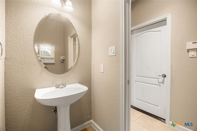 2291 Frontier, Spring Branch, TX 78070 - bathroom with tile patterned flooring and a textured wall