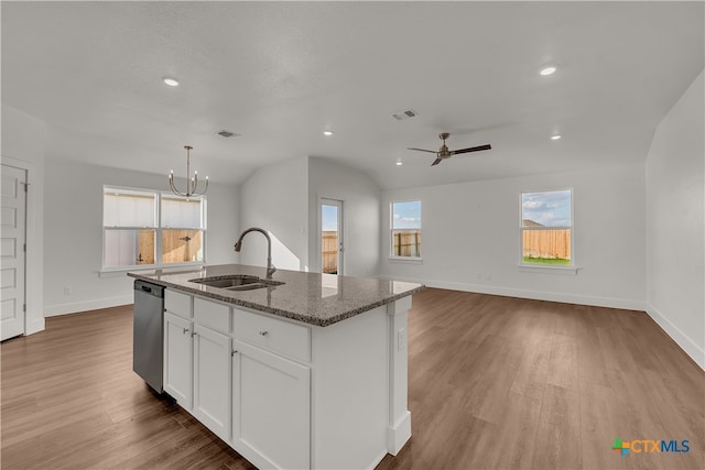 kitchen featuring sink, light hardwood / wood-style flooring, an island with sink, decorative light fixtures, and white cabinets