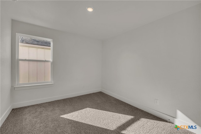 empty room featuring carpet flooring