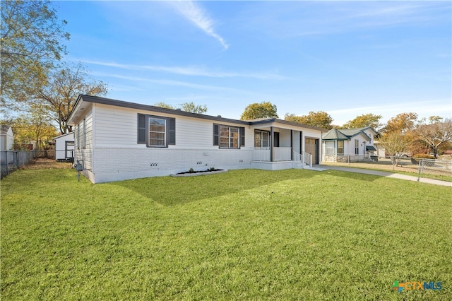 ranch-style home featuring a front yard