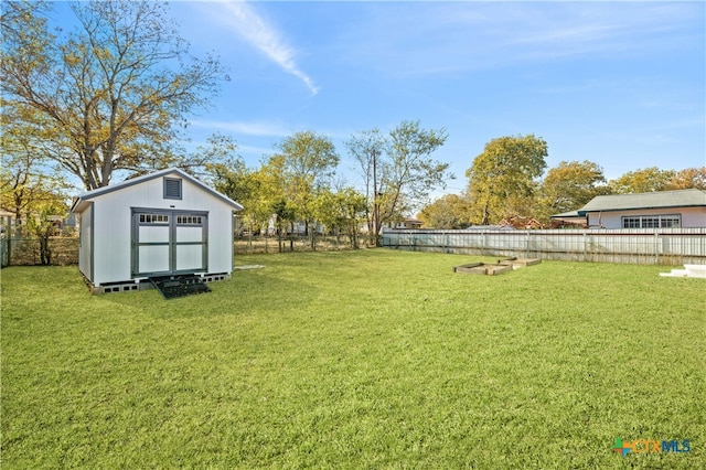 view of yard with a storage unit