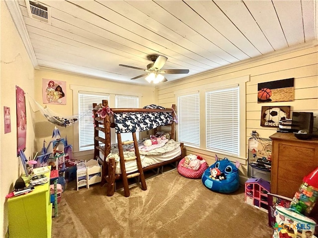 carpeted bedroom featuring crown molding, wooden ceiling, and ceiling fan