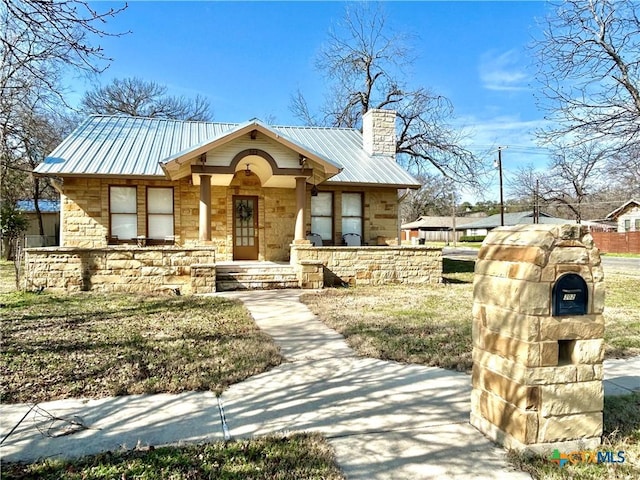 view of front of home with a front yard