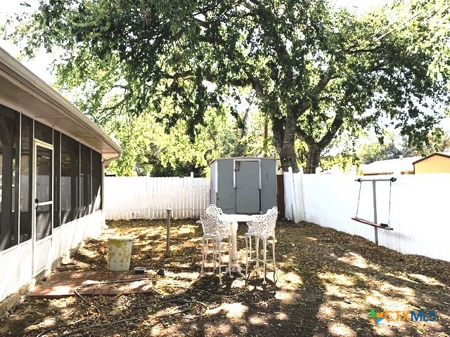 view of yard with a sunroom