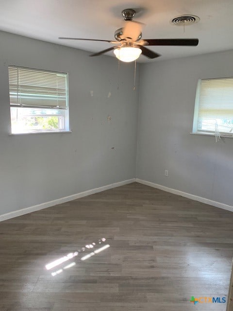 spare room featuring dark hardwood / wood-style floors