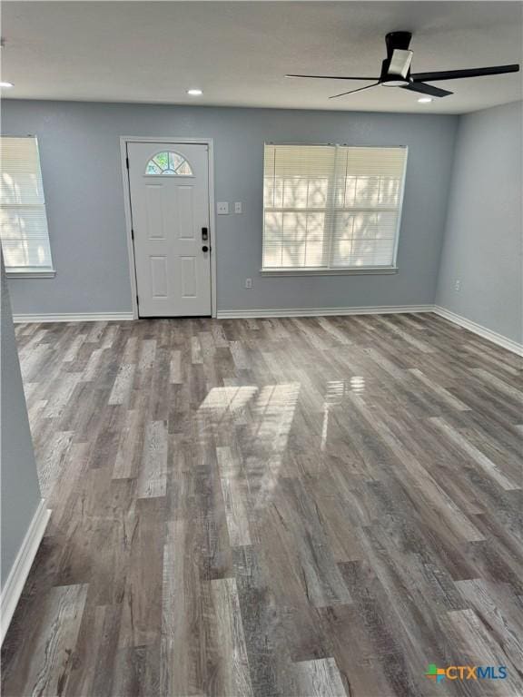 1037 N Guadalupe St, Seguin, TX 78155 - foyer entrance with wood finished floors, a ceiling fan, baseboards, and recessed lighting