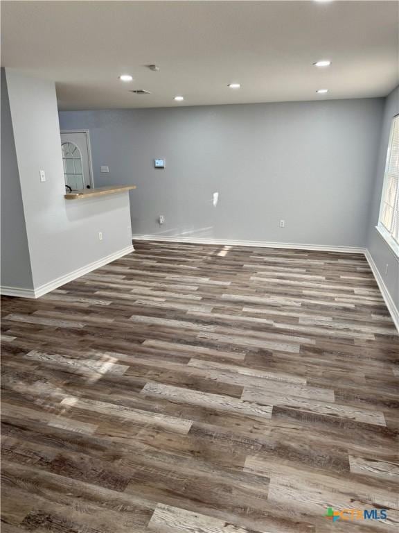1037 N Guadalupe St, Seguin, TX 78155 - unfurnished room featuring wood finished floors, baseboards, and recessed lighting
