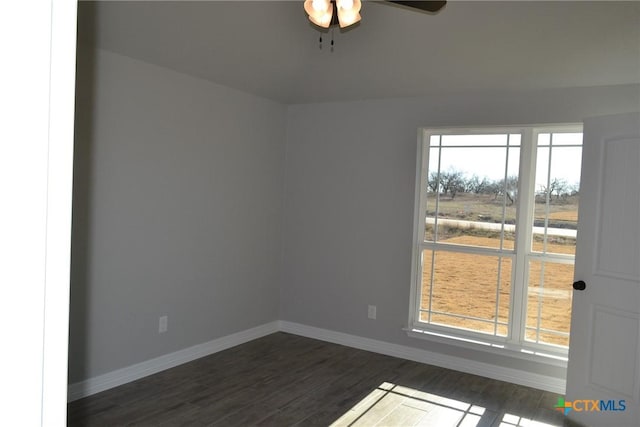 empty room featuring dark hardwood / wood-style floors and ceiling fan