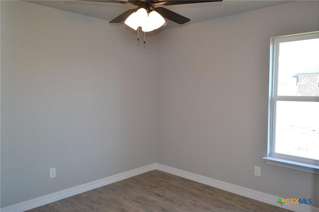 empty room featuring hardwood / wood-style flooring, plenty of natural light, and ceiling fan