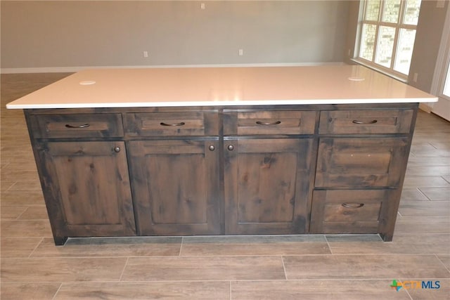 kitchen featuring dark brown cabinets