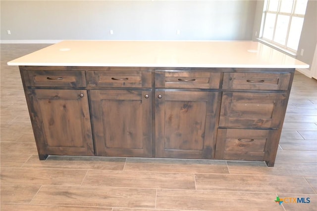 kitchen with dark brown cabinetry