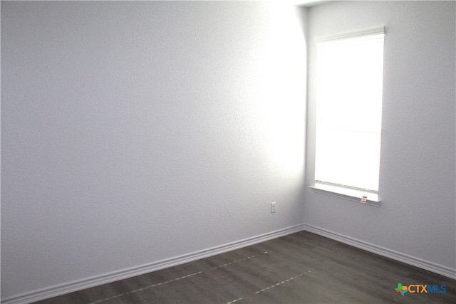 empty room featuring dark hardwood / wood-style floors