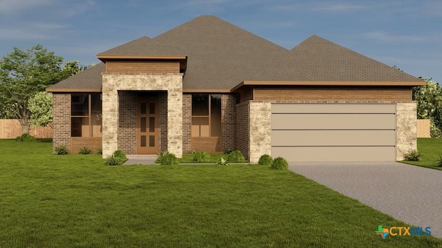 view of front of home featuring a garage and a front lawn