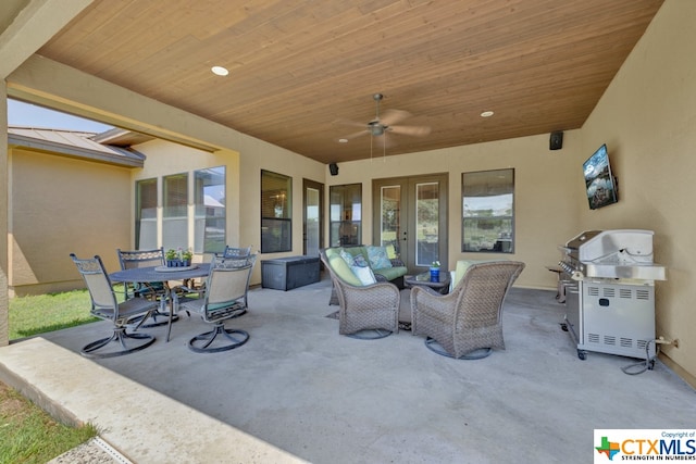 view of patio with ceiling fan and an outdoor living space