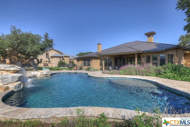 view of pool featuring pool water feature