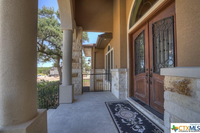 505 Cantera Rdg, New Braunfels, TX 78132 - view of exterior entry featuring french doors, stone siding, and stucco siding