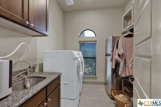 505 Cantera Rdg, New Braunfels, TX 78132 - washroom featuring independent washer and dryer, cabinet space, and baseboards