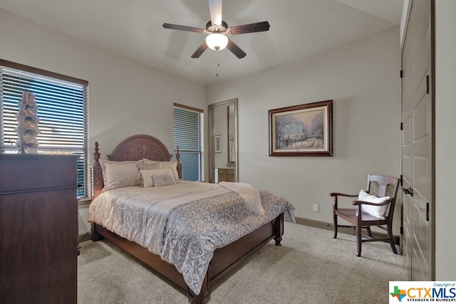 carpeted bedroom with ceiling fan