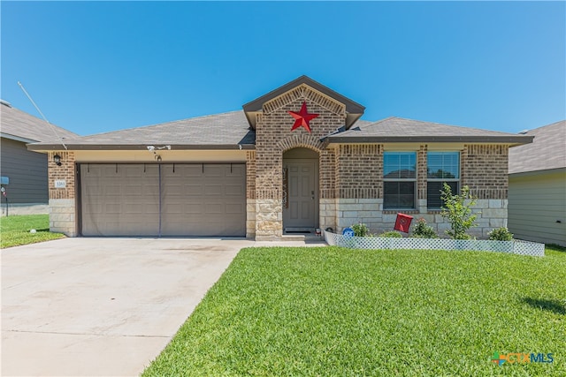 view of front of home featuring a front lawn and a garage