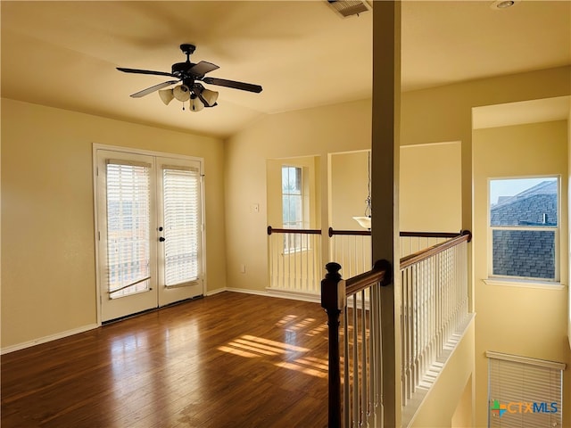 entryway with ceiling fan, lofted ceiling, french doors, and dark hardwood / wood-style floors