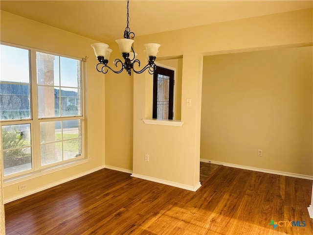 interior space with hardwood / wood-style flooring and a notable chandelier