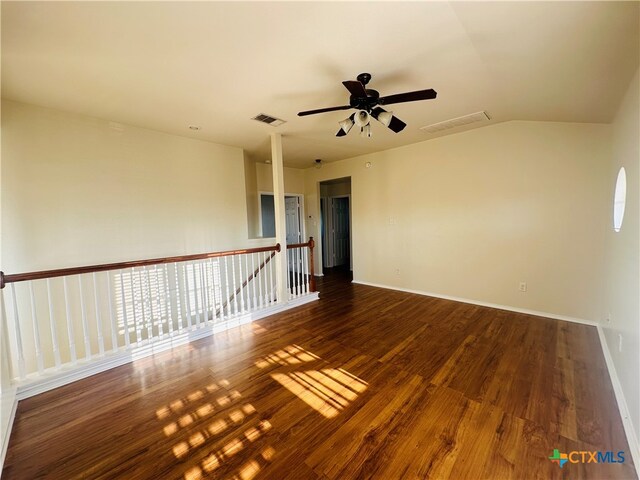 spare room featuring ceiling fan, vaulted ceiling, and dark hardwood / wood-style floors