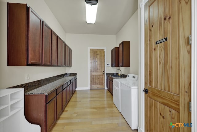 800 High Oaks Rd, Canyon Lake, TX 78133 - laundry room featuring cabinet space, washing machine and clothes dryer, light wood-style flooring, and baseboards