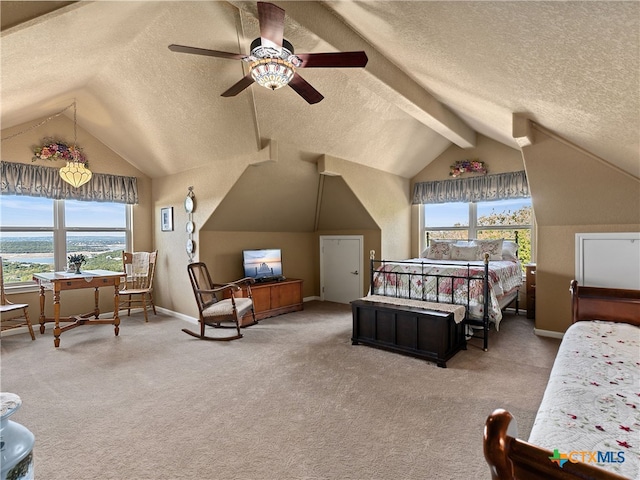 bedroom with carpet flooring, ceiling fan, a textured ceiling, and vaulted ceiling