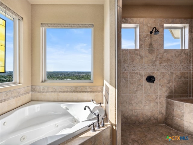 bathroom with independent shower and bath