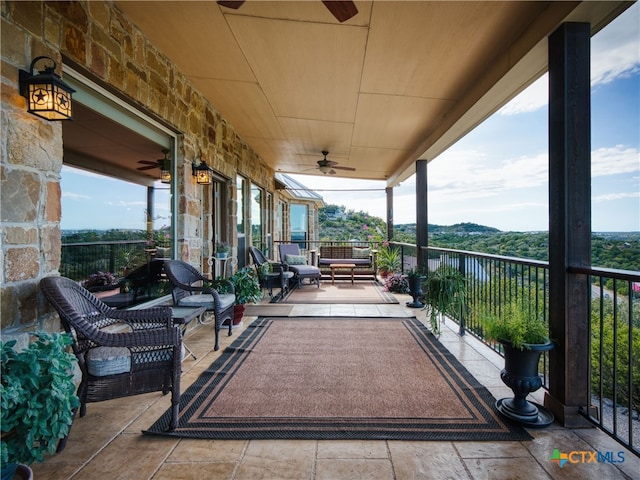 balcony featuring ceiling fan